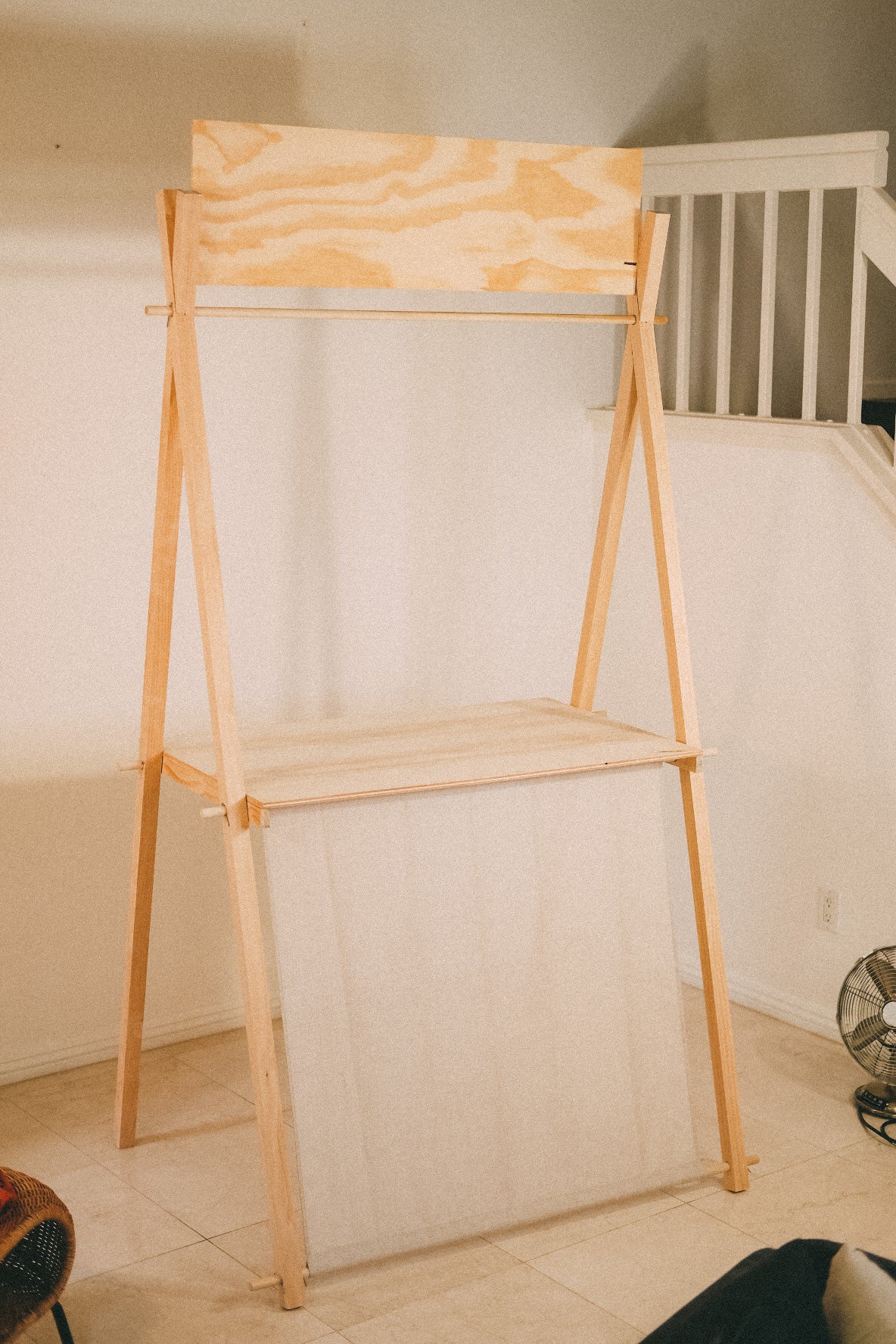 Full view of the empty EPD-1 wooden market counter with a tabletop, front panel, hanging rail and blank header board.